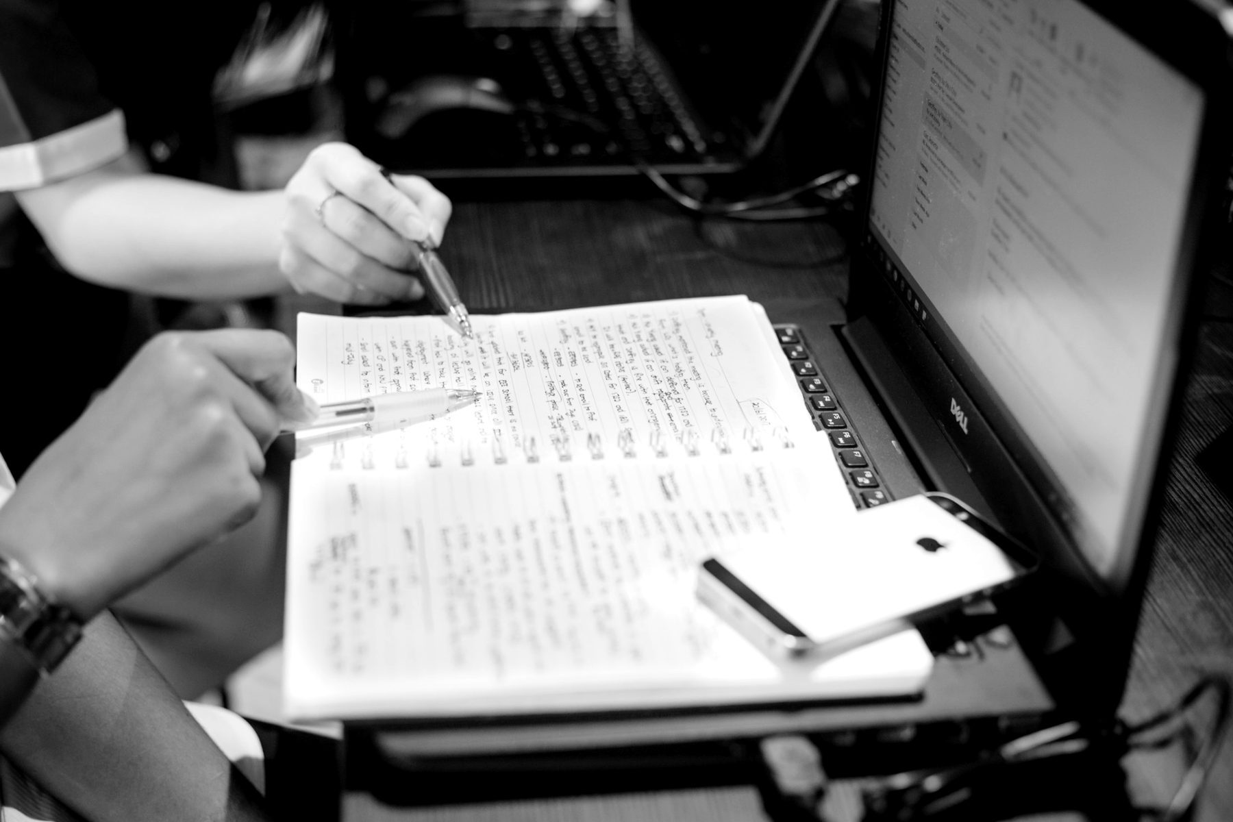 Professionals working through notes together